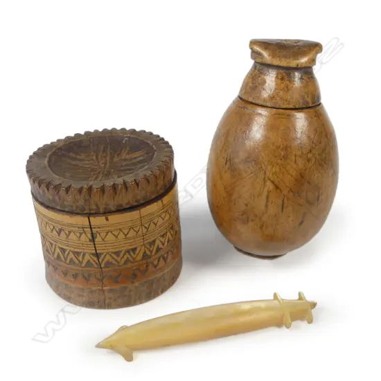 A Timorese tobacco box; a Suluwesi betel box and a Solomon Islands pearl shell lure shank.