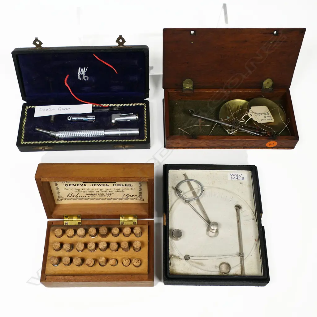 A balance scale, a yarn scale, a dental drill handpick and a set of watch part phials, all in boxes. Image 1++