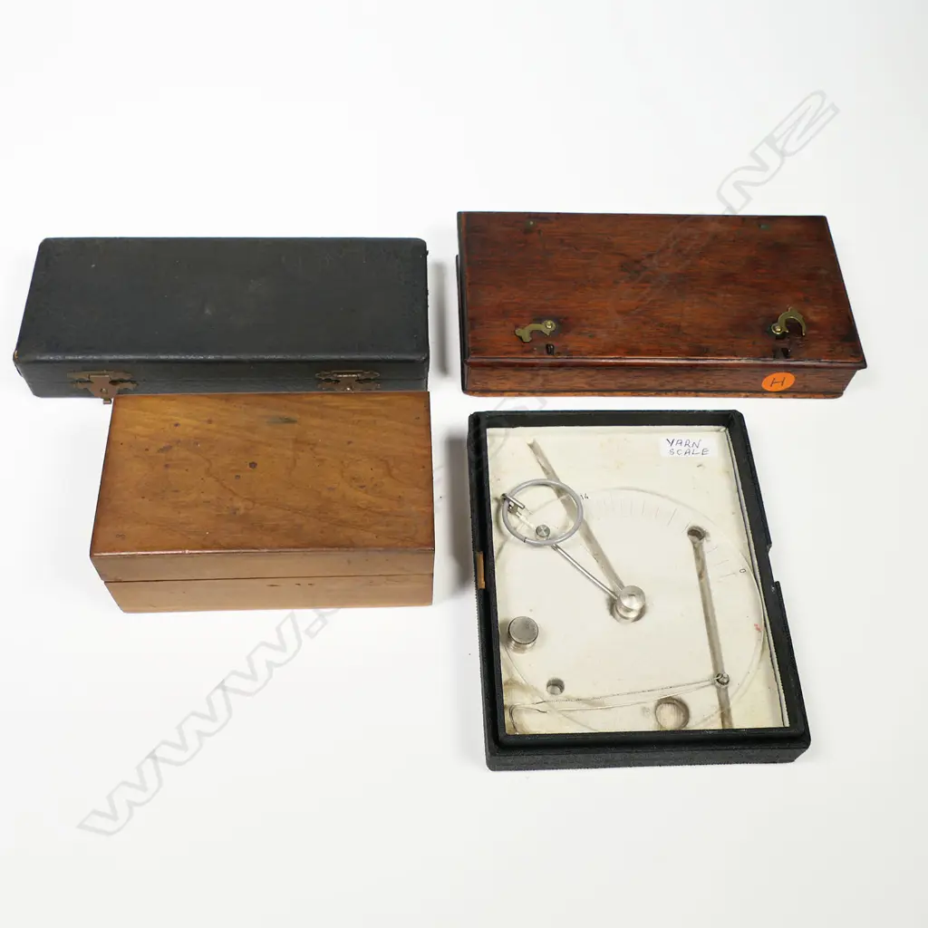 A balance scale, a yarn scale, a dental drill handpick and a set of watch part phials, all in boxes. Image 1++