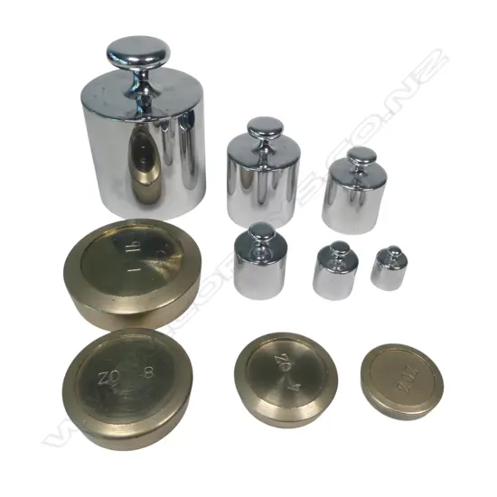 A set of six chrome cylinder weights and a four pan weights 2oz-1lb
