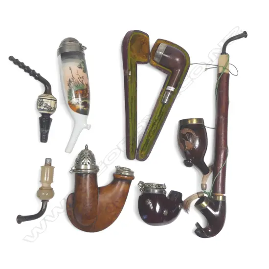 Three old German wooden pipes, a German transfer decorated pipe bowl and an English briar pipe bowl with silver rim, lacking stem
