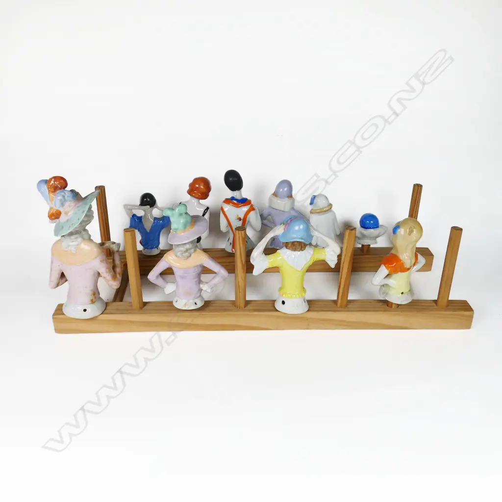 A collection of ten porcelain half-dolls, of various sizes, the largest with faults. Image 1++