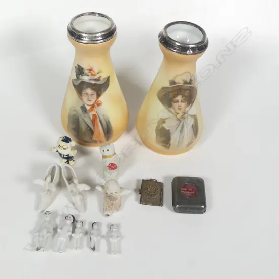 A pair of spill vases decorated with portraits of women after the illustrator Philip Boileau, silver rimmed, London 1912 by Henry Perkins & Sons. Along with a collection of mini Xmas pudding and cake dolls; a mini English Dictionary and mini Napoleonic portraits locket.
