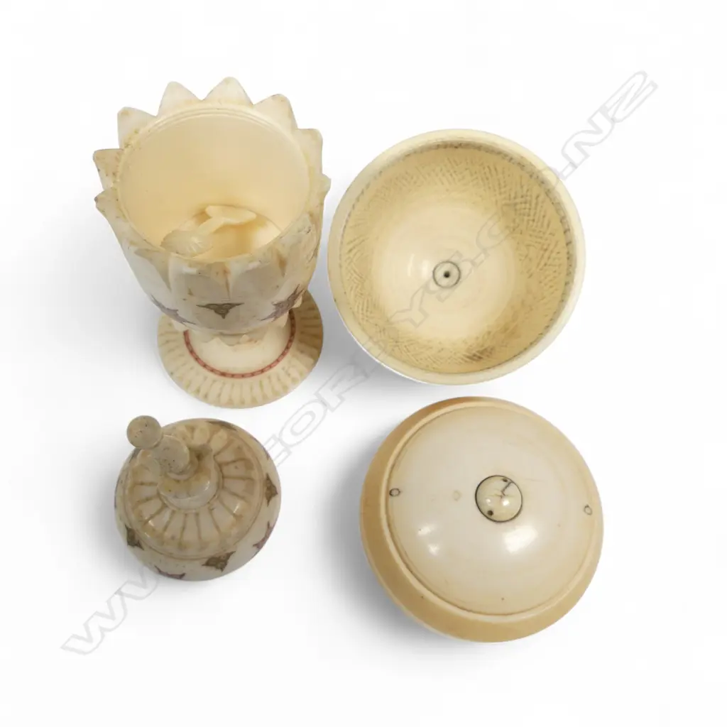 A turned solid ivory two-piece box of rounded shape, and an Indian turned bone urn on pedestal foot decorated with coloured circle cut designs. H.140mm Image 1++