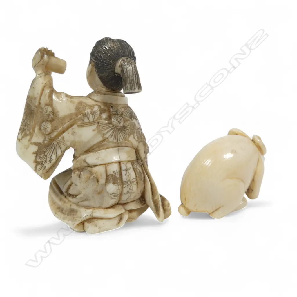Two Japanese ivory carvings - an small okimono of a samurai kneeling whilst proffering a scroll (some losses), and a compact netsuke of a crouching rabbit. Image 1++