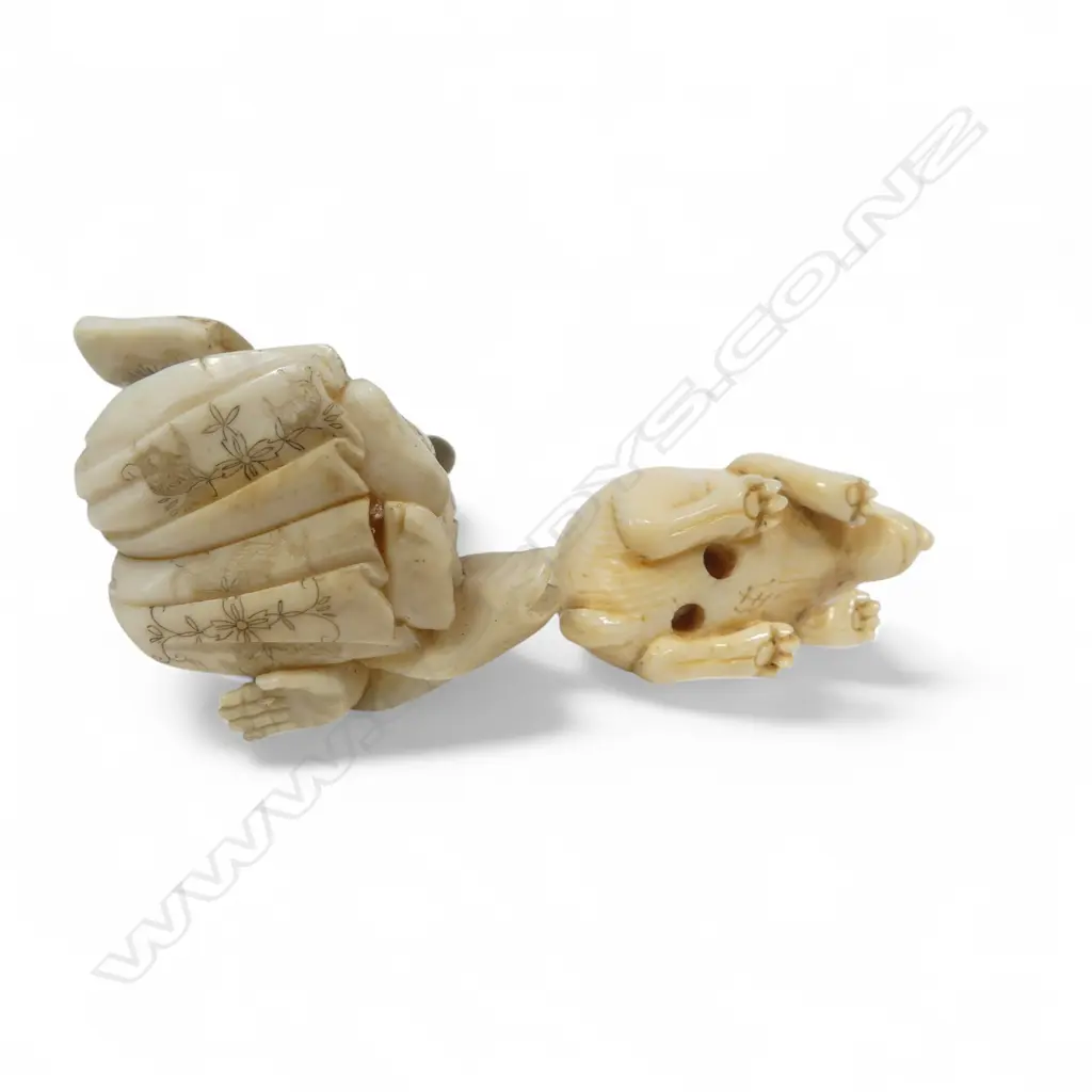 Two Japanese ivory carvings - an small okimono of a samurai kneeling whilst proffering a scroll (some losses), and a compact netsuke of a crouching rabbit. Image 1++