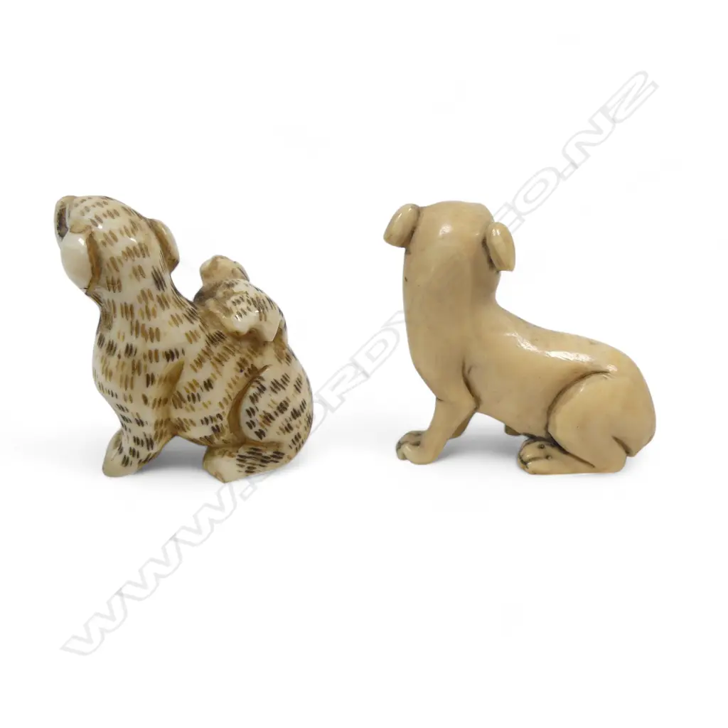 Two small Japanese ivory netsuke - a spotted dog with pup climbing its haunches; an a seated dog. Image 1++
