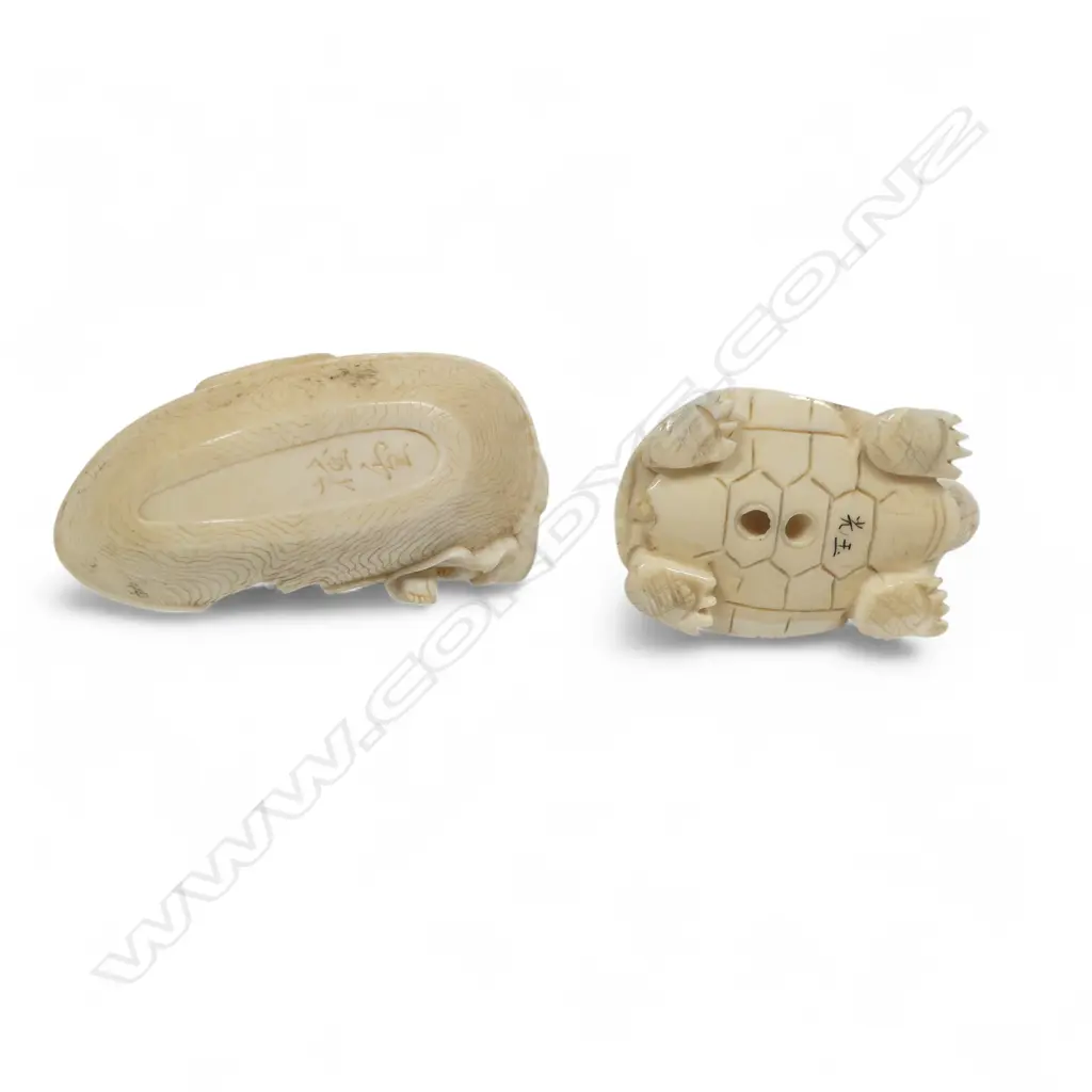 Two small Japanese ivory netsuke - Hotei with treasure sack adrift in a boat (AF), and a frog riding on the back of a tortoise. Both signed. Image 1++