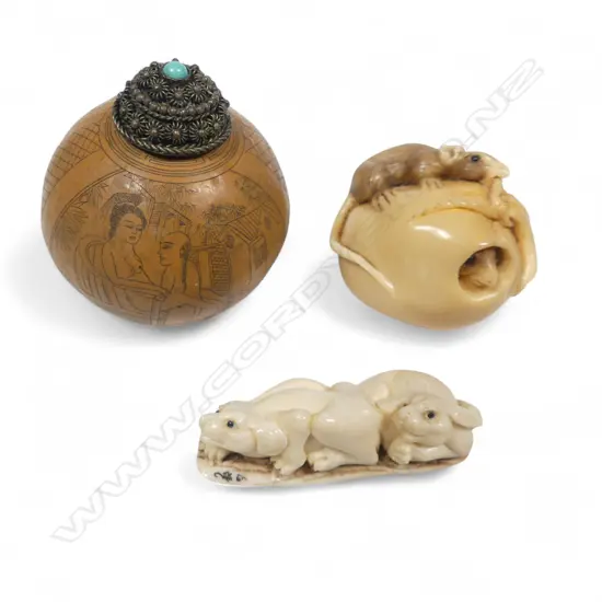 Two Japanese netsuke and a snuff gourd - the ivory netsuke of two hounds; the coroza nut netsuke of a food sack, one rat inside another gnawing on the rope binding; the small spherical gourd with erotic engraving.