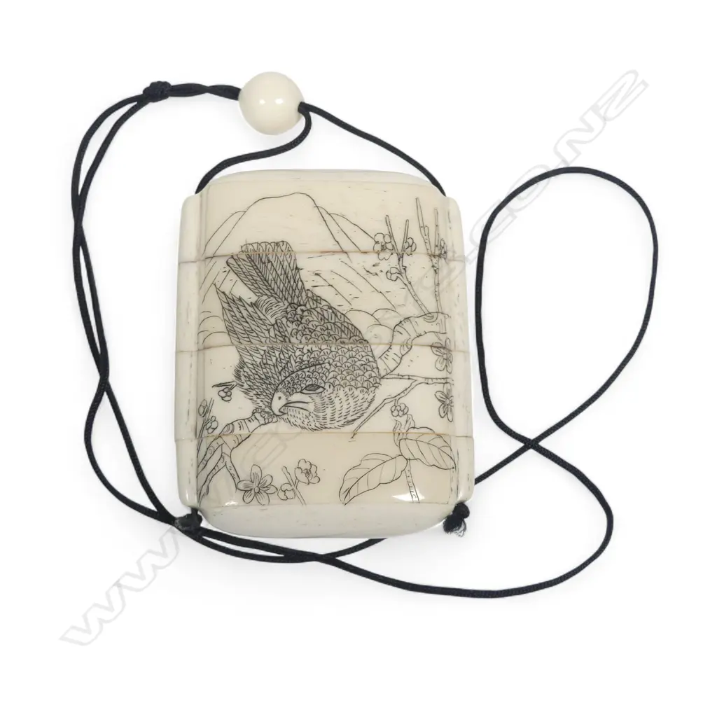 A sectional bone inro, of four compartments, engraved with a boating party to one side and a hawk to the other. H.75mm Image 1++