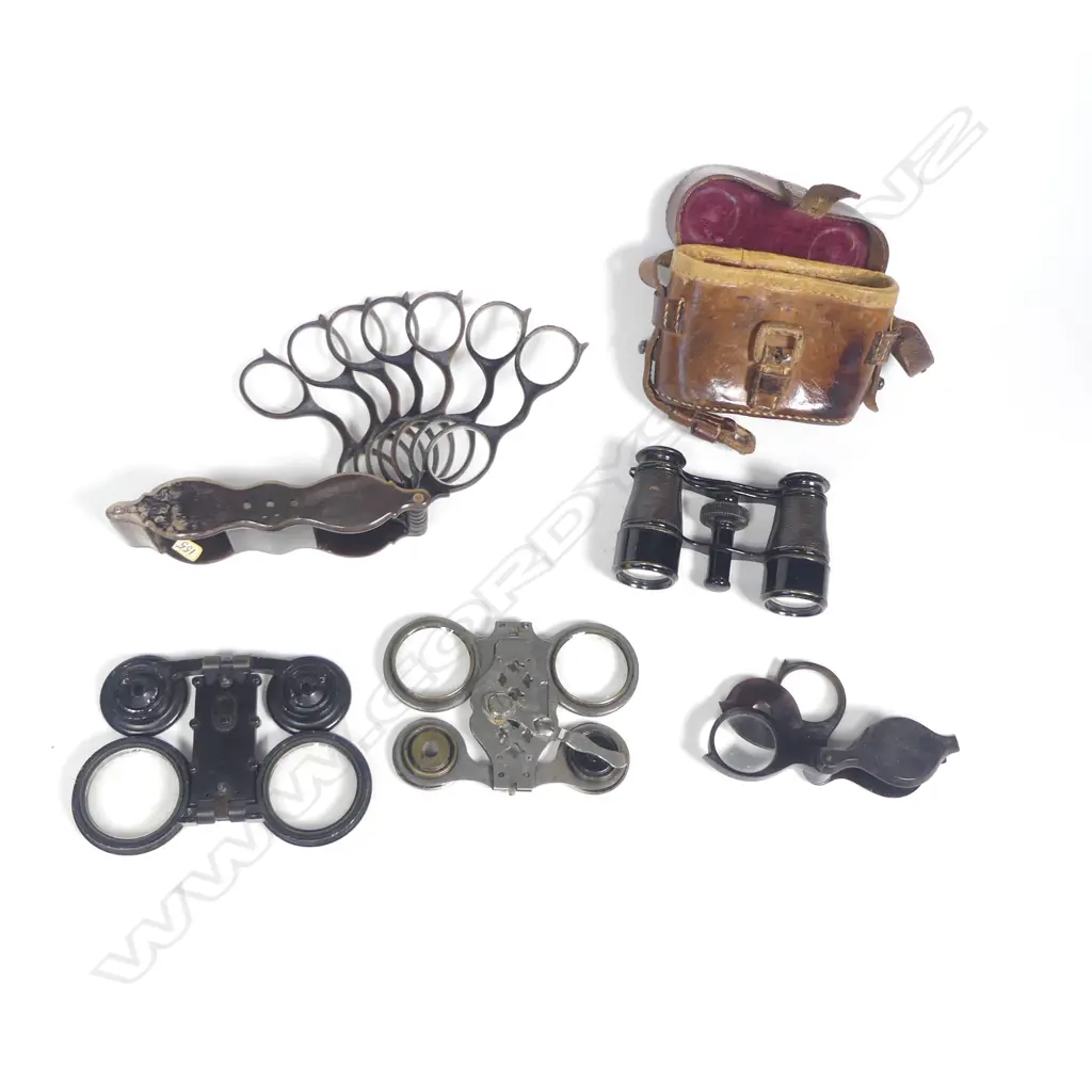 Two pairs of collapsible opera glasses, cased opera glasses, an opticians' horn framed set of trial lenses and a horn framed pocket magnifier, Image 1++
