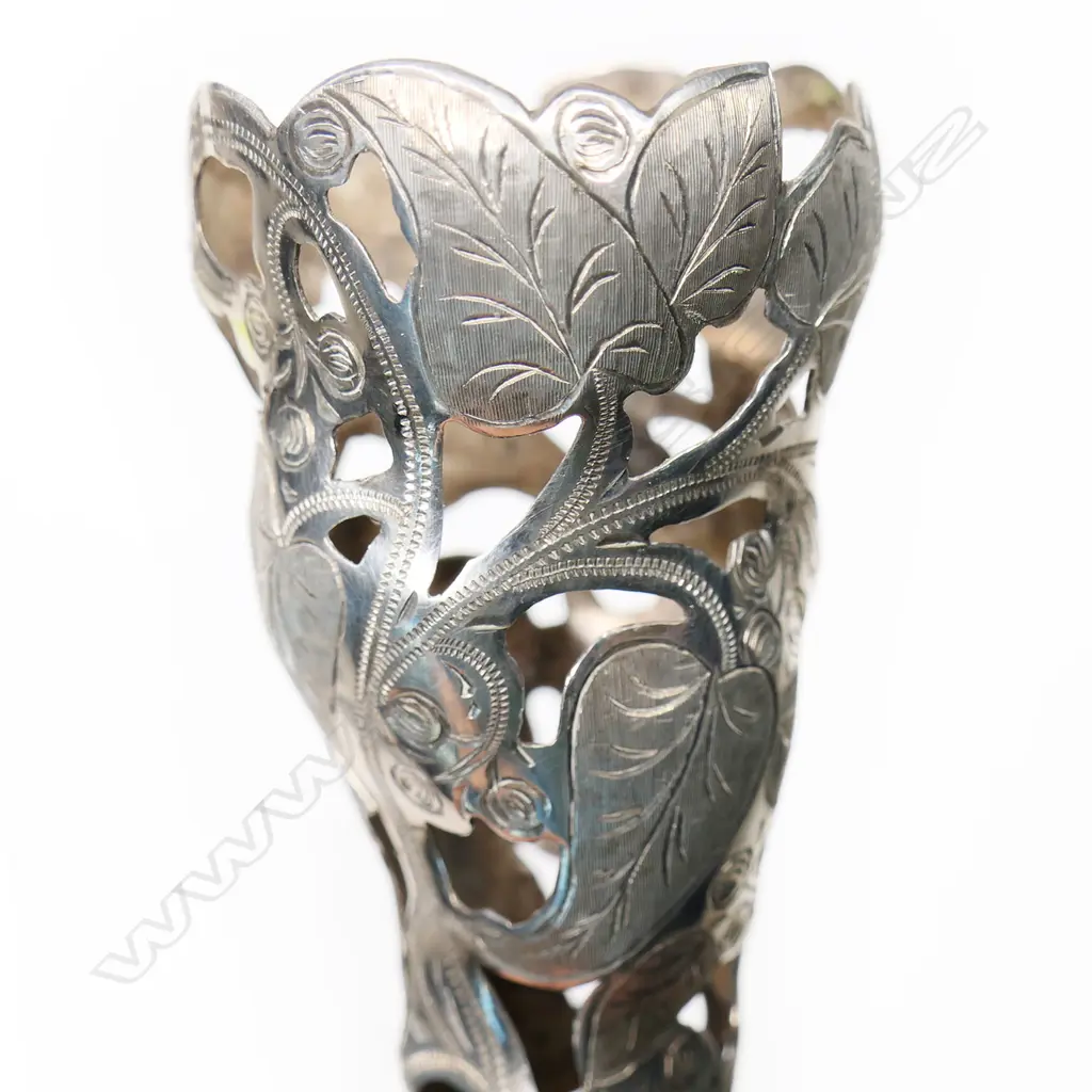An Edwardian silver plated tussie-mussie of bouquet holder, the cone pierced and engraved with ivy leaves, on a tapering handle with conforming engraving. H.160mm Image 1++
