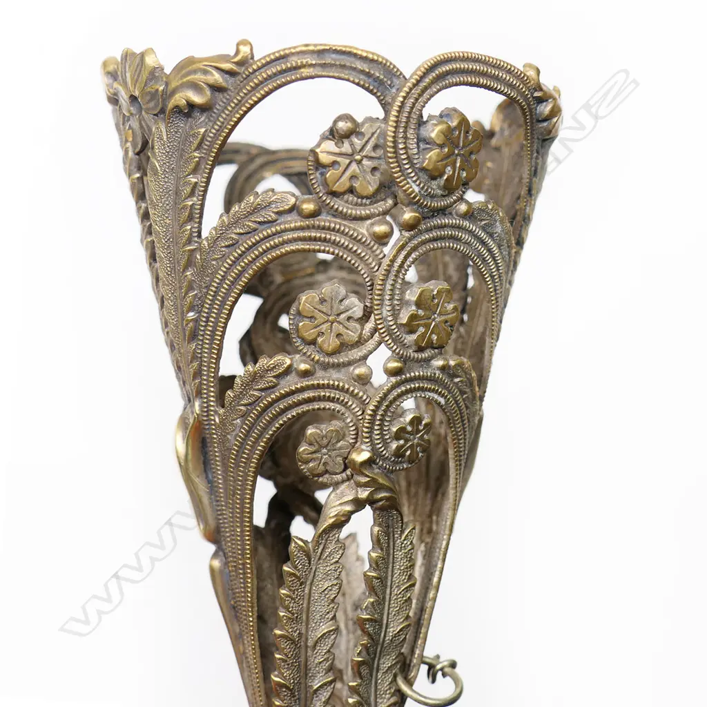 A gilt brass bouquet holder, possibly French, the cone cast and pierced with acanthus and lilies, on a hexagonal tapering handle. H.155mm Image 1++