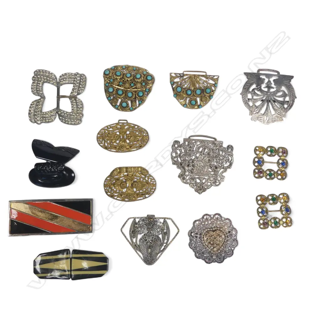 A collection of silver plated, gilt metal and enamelled fancy belt buckles, some half only Image 1++