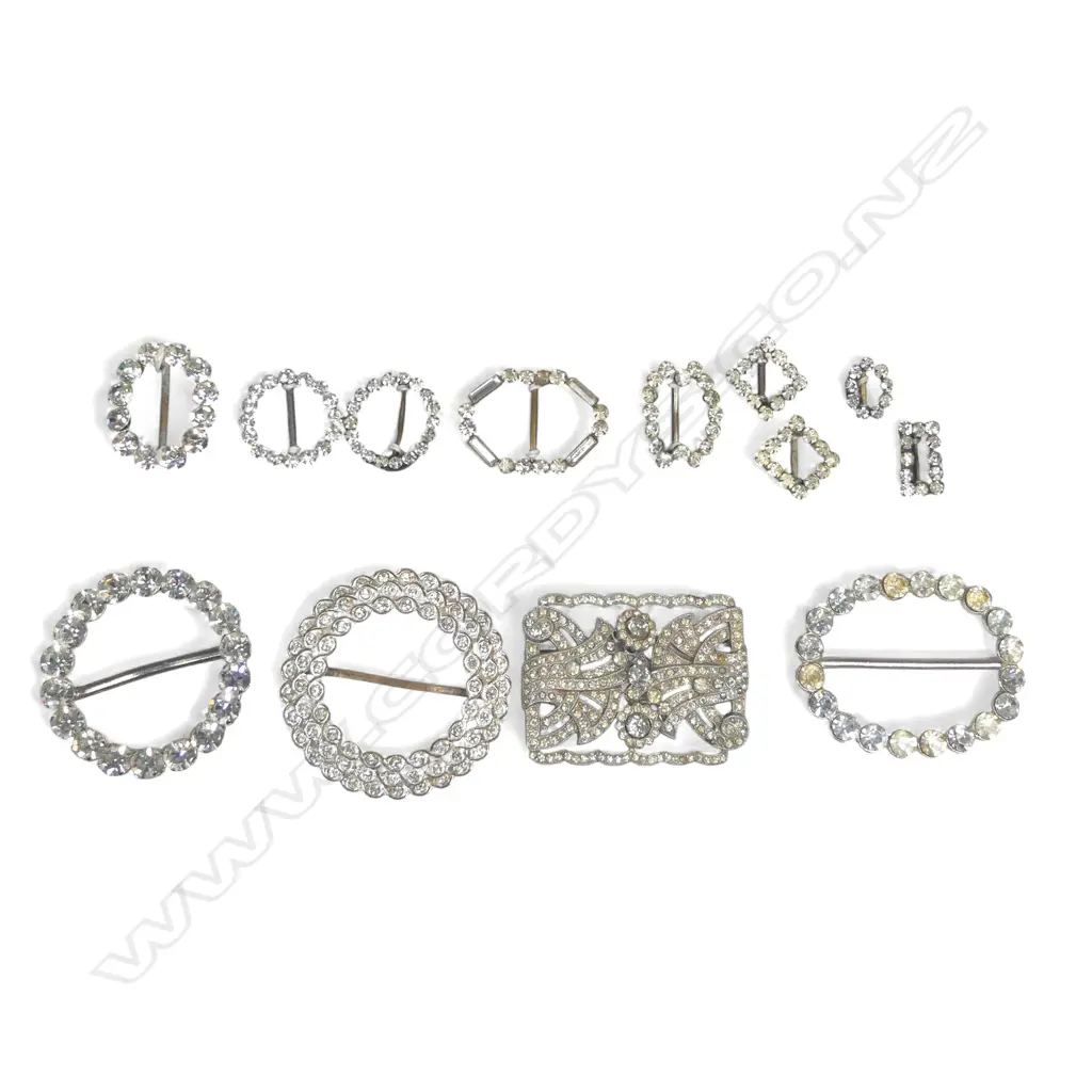 nine vintage diamonté sash choker or scarf buckles on a card; three larger diamonté buckles and a German Art Deco paste brooch Image 1++