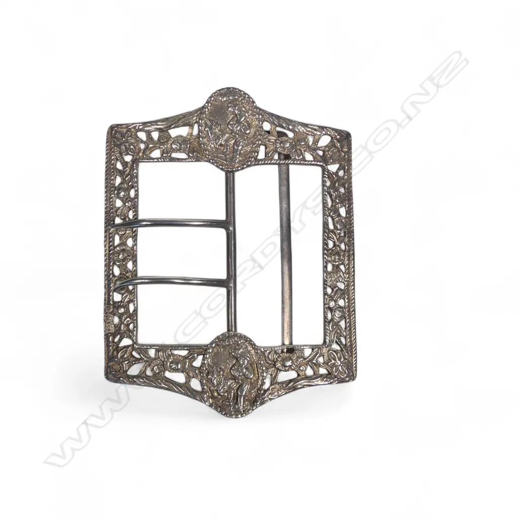 A large late Victorian sterling silver sash belt buckle with two prongs, the cast and pierced frame with  figurative panels. London 1899 by Samuel Jacob. 95 x 70mm Image 1++