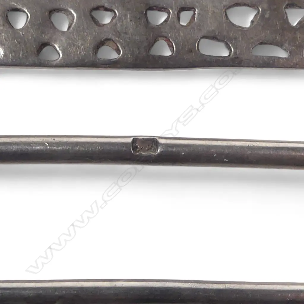 A large late Victorian sterling silver sash belt buckle with two prongs, the cast and pierced frame with  figurative panels. London 1899 by Samuel Jacob. 95 x 70mm Image 1++