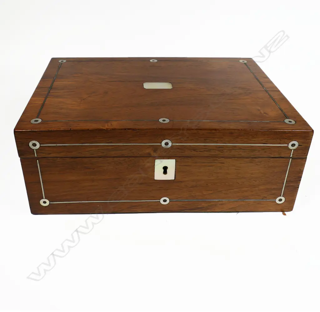 A late 19thC walnut workbox, inlaid with mother-of-pearl escutcheon, cartouche and rondels. Blue silk interior. With a collection of various doll's house dolls and parts. 280 x 200 x 100mm. Image 1++