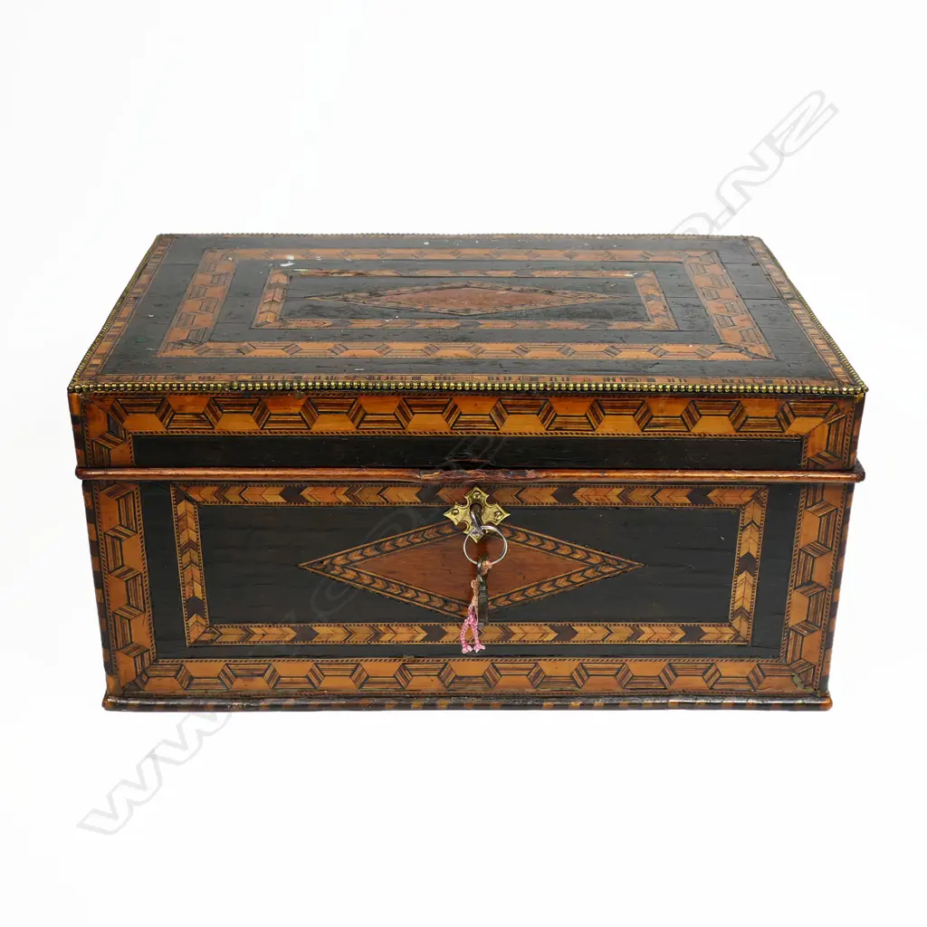 An ornate 19thC Tunbridge ware work box, with multiple chevron and ribbon bands to the top and walls. The interior with lidded compartments to a removeable top tier. The lower tier with a lift out tray flanked by drawers. With keys. 330 x 220 x 155mm Image 1++