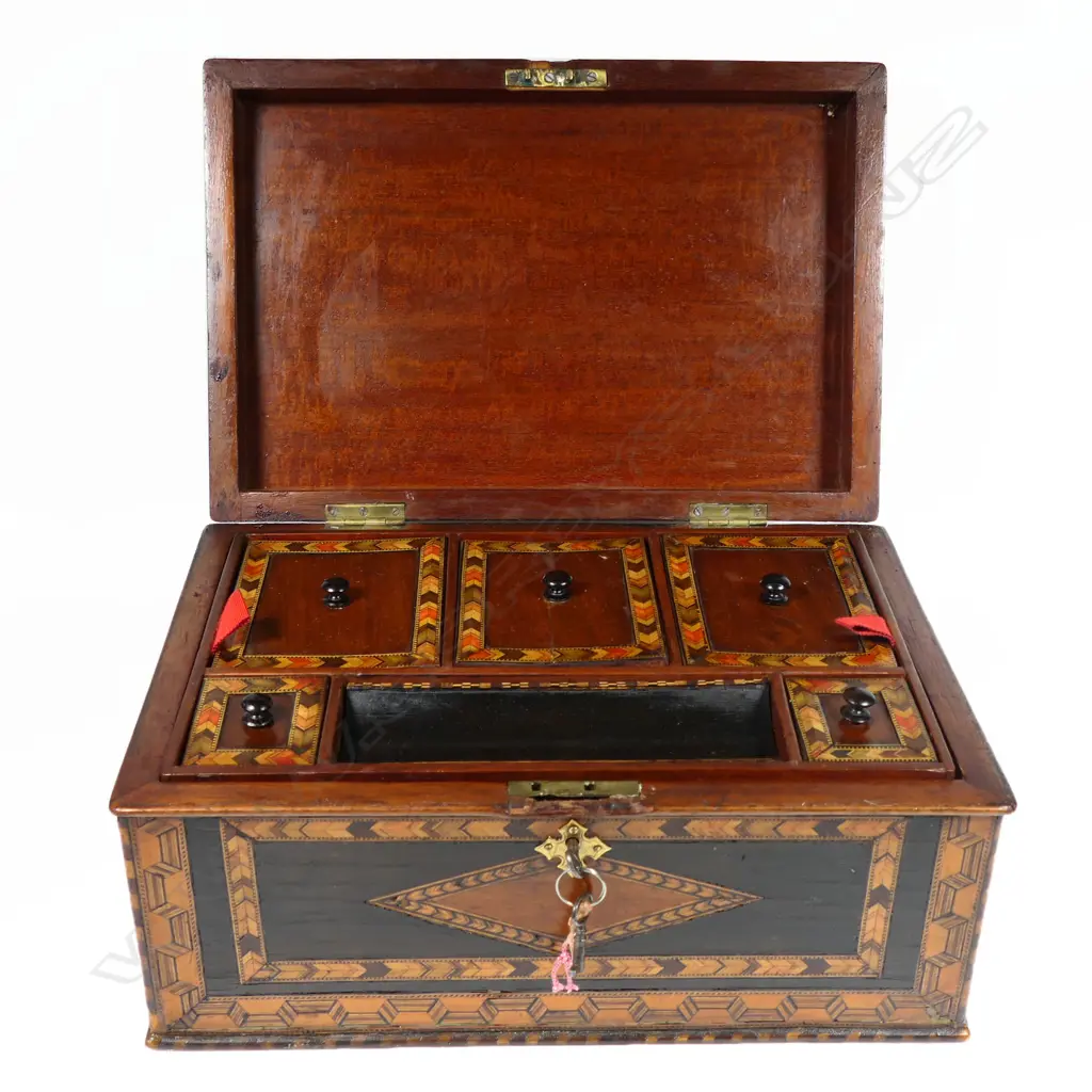 An ornate 19thC Tunbridge ware work box, with multiple chevron and ribbon bands to the top and walls. The interior with lidded compartments to a removeable top tier. The lower tier with a lift out tray flanked by drawers. With keys. 330 x 220 x 155mm Image 1++