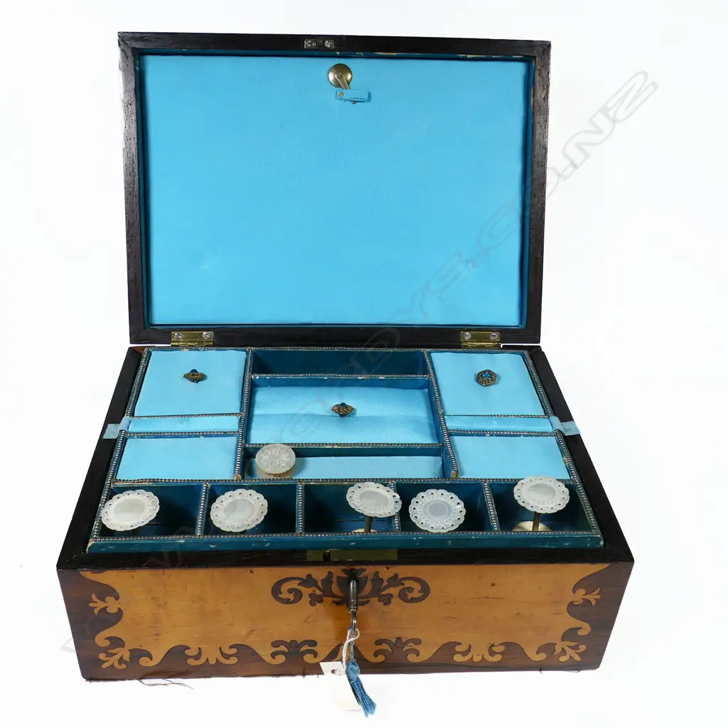 A Victorian maple and rosewood marquetry veneered workbox, relined with silk and containing mother-of-pearl bobbins, Image 1++