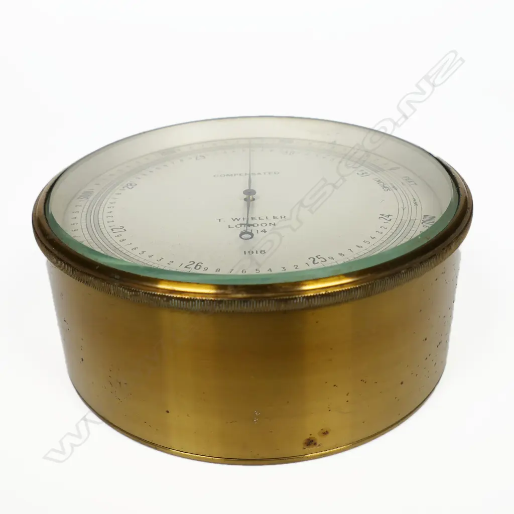 A WW1 1918 dated British Naval barometer/altimeter by T. Wheeler, London the dial marked 'Compensated, T. Wheeler , London, 4114, 1918', in a brass case marked verso with broad arrow mark, Image 1++