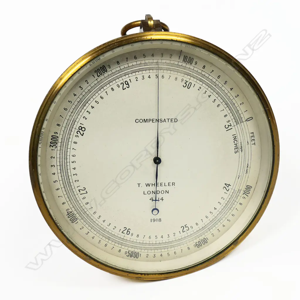 A WW1 1918 dated British Naval barometer/altimeter by T. Wheeler, London the dial marked 'Compensated, T. Wheeler , London, 4114, 1918', in a brass case marked verso with broad arrow mark, Image 1++