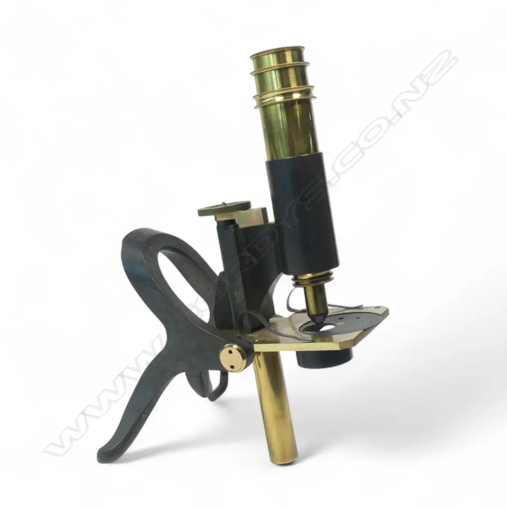 A 19thC polished and lacquered brass monocular student's microscope by J. Swift, 43 University St, London, WC, Image 1++
