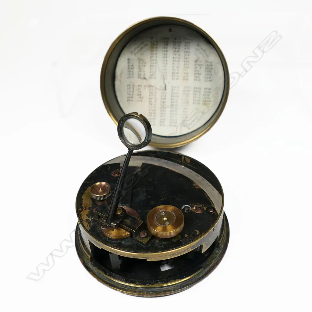 A blackened brass drum or pocket sextant by F Barker & Son, London, with silver scale from -5º to 140º, vernier from 0º to 30º, hinged and swivelling scale magnifier. Dia.80mm. Image 1++