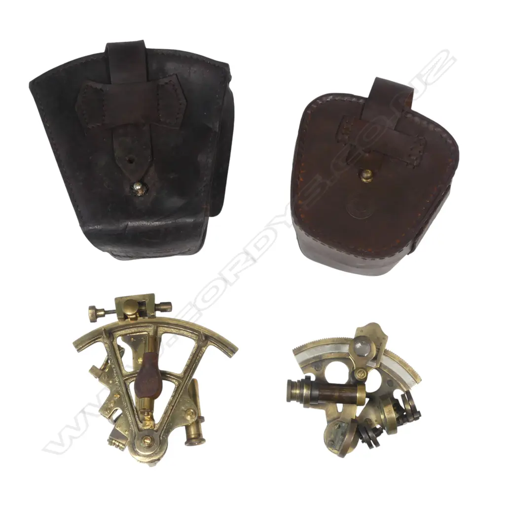 Two 20thC replica brass miniature sextants, both marked Stanley, 4" arc with military arrow and date 1916, the smaller 2½" arc dated 1884. With leather cases. Image 1++