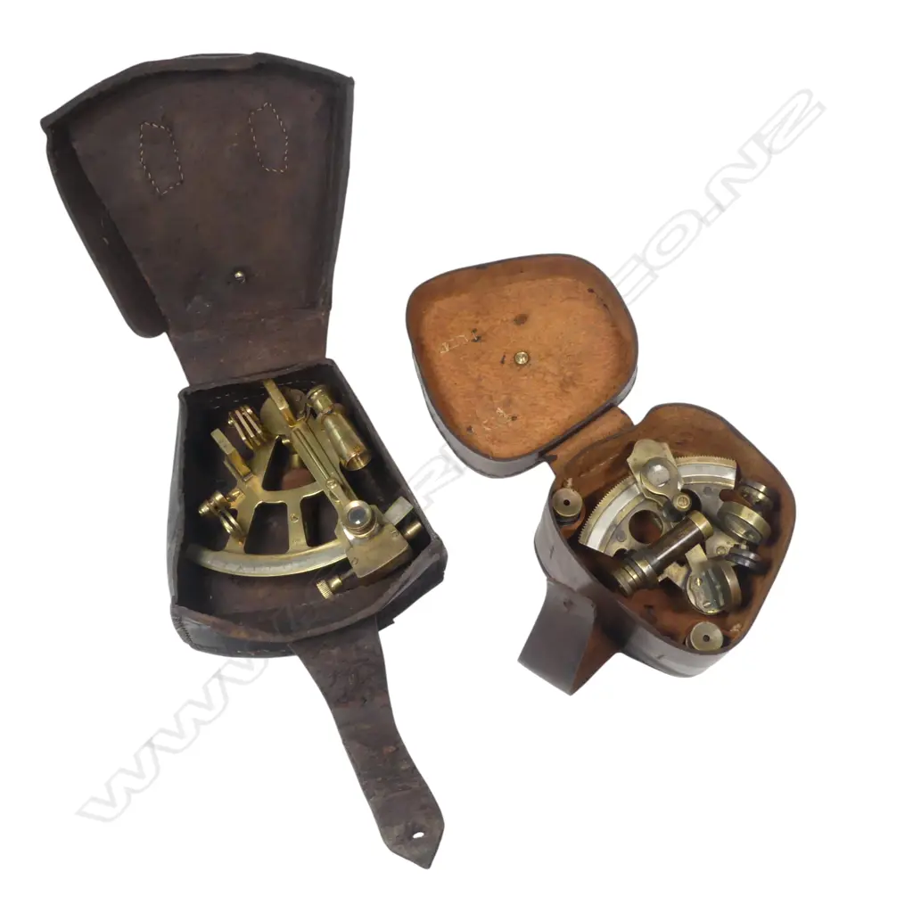 Two 20thC replica brass miniature sextants, both marked Stanley, 4" arc with military arrow and date 1916, the smaller 2½" arc dated 1884. With leather cases. Image 1++