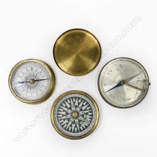 Three pocket compasses; two open face with pivot needles and a floating dial in brass press lidded case
