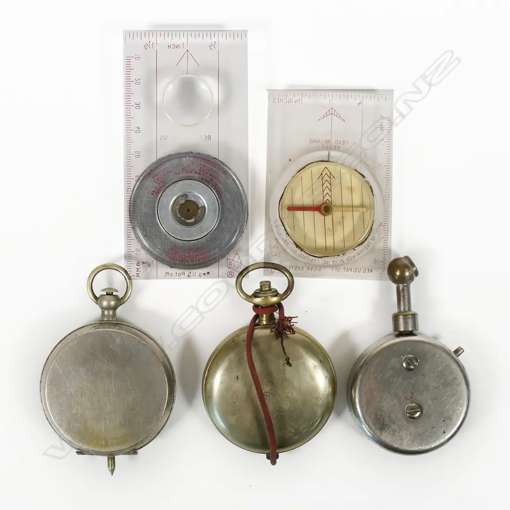 Two pocket watch-type voltmeters; US Gauge Co., NY tire pressure gauge; Silva Type 5 induction damped compass c.1960; and a Silva Type 342 compass. (5) Image 1++