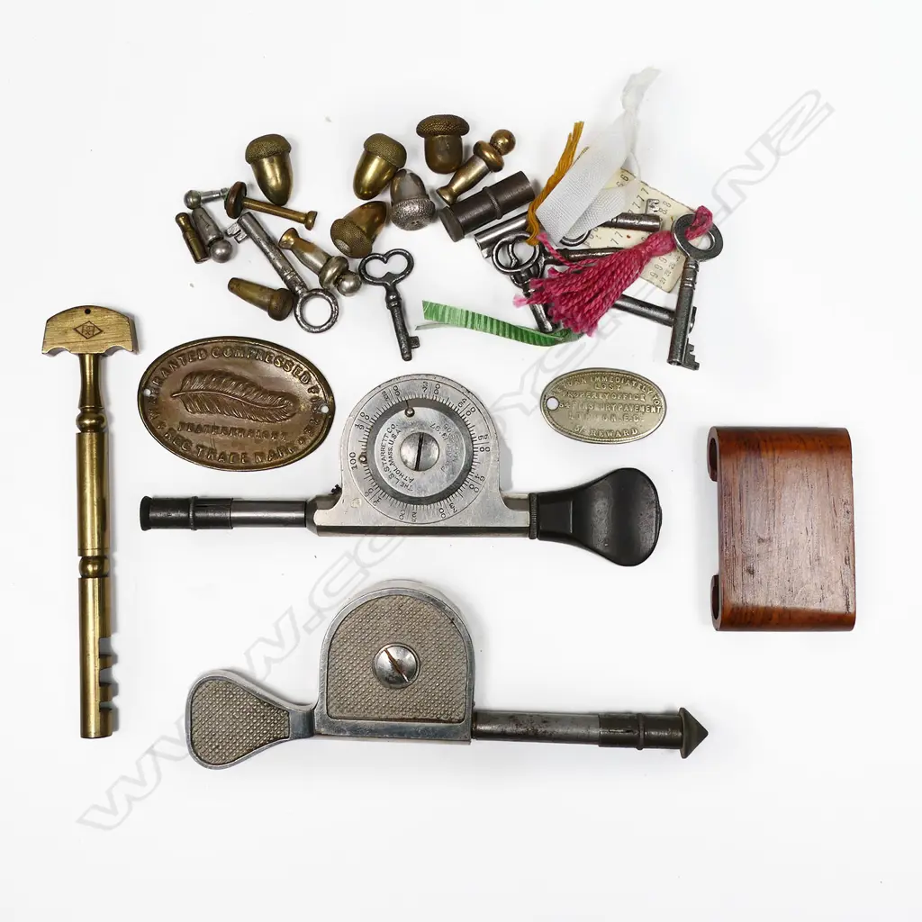 Two L. S. Starret Machine Speed Indicator Tools, a brass glass cutter, small keys and hat pin protector ends. Image 1++