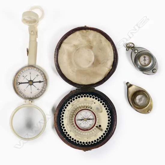 A German celluloid folding combo mirror, compass, loupe and opera glasses; leather cased mid-19thC ivory pocket compass (thermometer absent); two mini fob compasses with fold out magnifying glass to one and coin silo to the other.