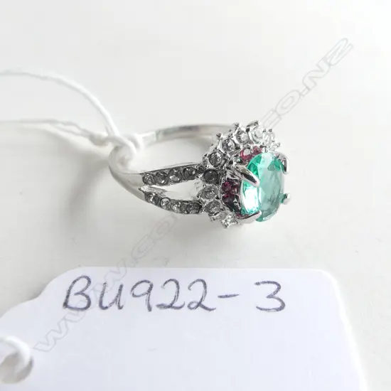 FAUX GREEN COLOURED / WHITE STONE RING IN SILVER COLOUR