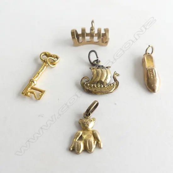 3 9ct GOLD CHARMS SHOE. KEY. TOAST RACK 2.5gms + 2 OTHERS SILVER