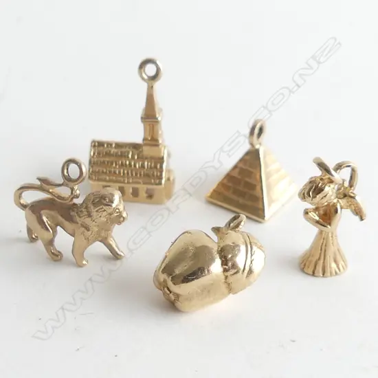 5 9CT CHARMS; CHURCH, PYRAMID, ANGEL, APPLE & LION 6.8 GRAMS