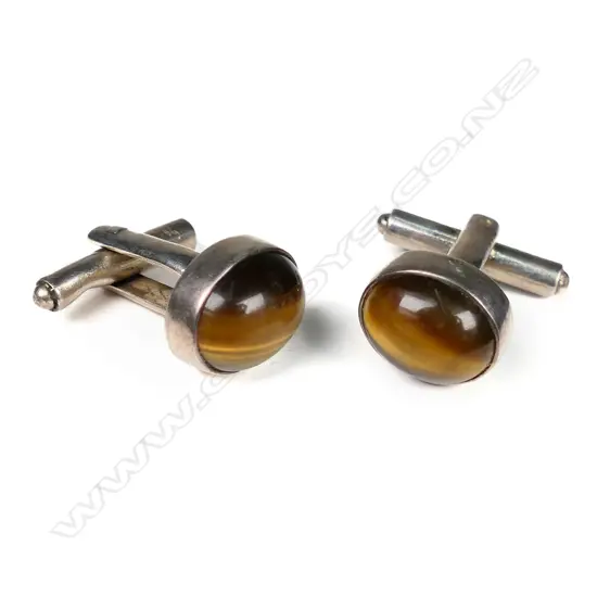 A pair of vintage silver and tigers eye cufflinks,
