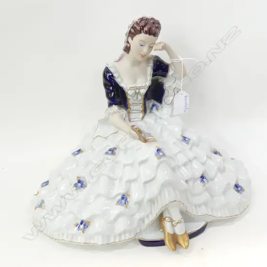 LGE ROYAL DUX FIGURINE; SEATED LADY w. WIDE SKIRT READING W.330mm