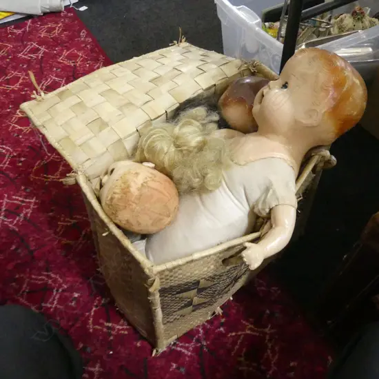 FLAX BASKET OF DOLLS; 2 CELLULOID + 2 PORCELAIN + 1 CELLULOID HEAD