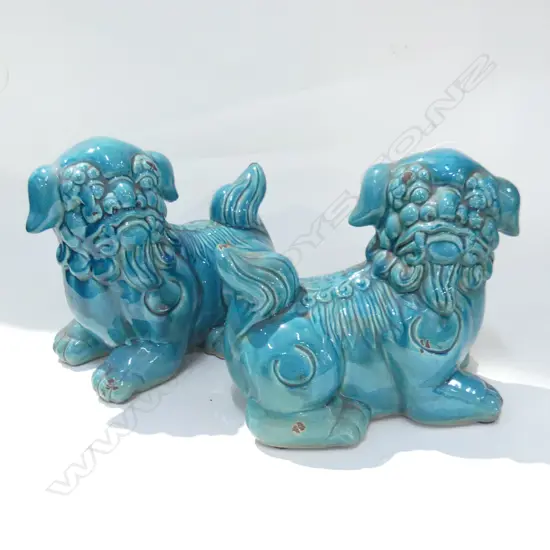 PR TEAL CERAMIC FOO DOGS L 240MM (SOME MINOR CHIPPING TO COLOUR)