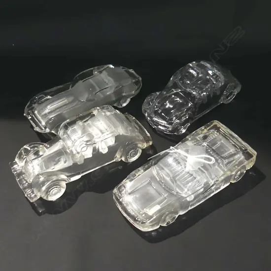 FOUR ART GLASS MODEL CARS