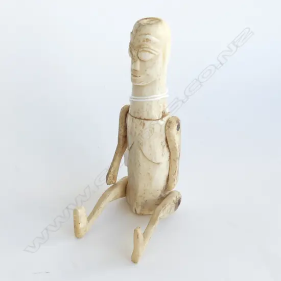 An Indonesian carved bone articulated ancestral figure