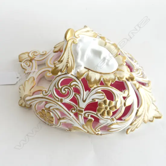 VERSACE STYLE CERAMIC WALL POCKET. MARKS ON BACK INDICATIVE OF FRENCH MANUFACTURE. CRANBERRY GLASS LINER. H.240mm