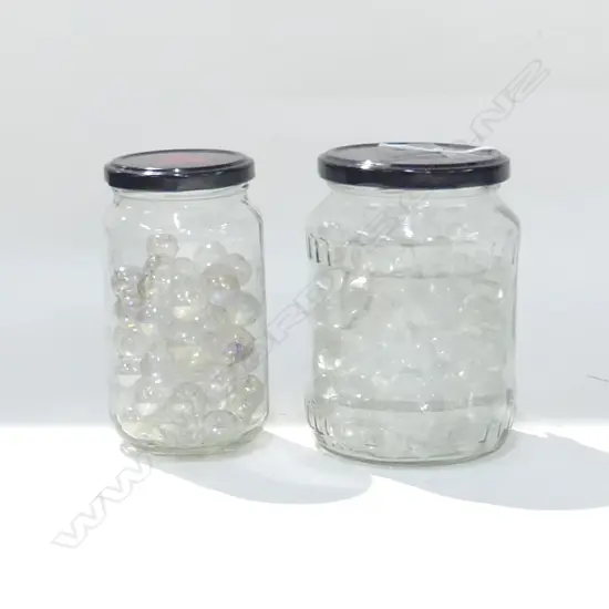 2 LG GLASS JARS FULL OF COLOURED BEACH GLASS .+ 2 JARS MARBLES 