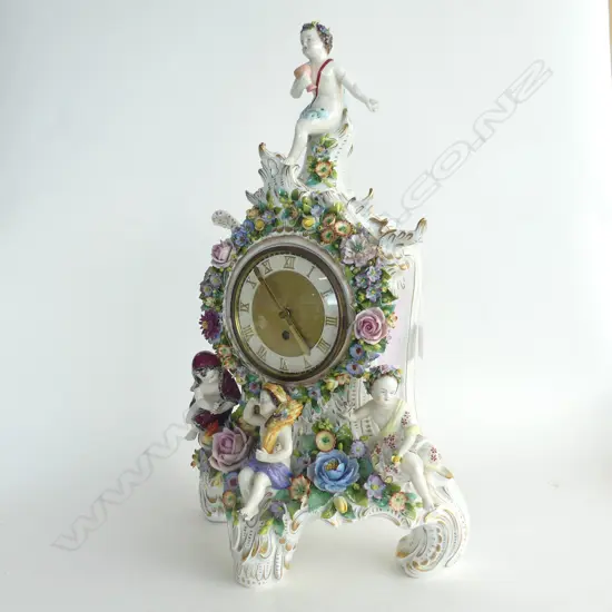 LARGE DRESDEN 'FOUR SEASONS'  MANTLE CLOCK WITH KEY H. 490MM (HAS REPAIR TO ARM OF TOP FIGURE)