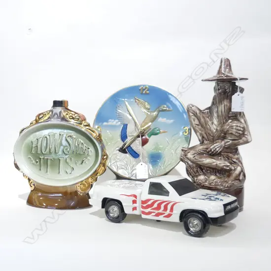 4 NOVELTY DECANTERS; DUCK CLOCK, 'HOW SWEET IT IS', BUSHMAN, JIM BEAM TRUCK L.270mm