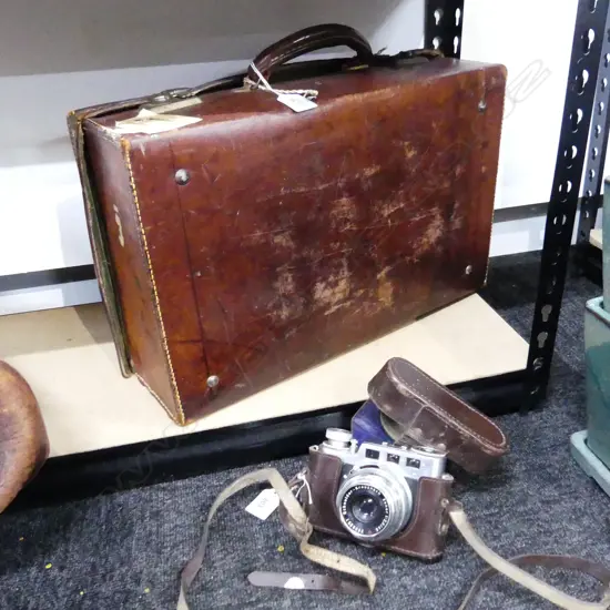 2 ITEMS. 35MM DIAX 1 A CAMERA BY W. VOSS AND LEATHER SUITCXASE 