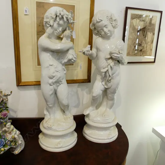 PR WHITE GLAZED PORCELAIN STATUES; CHILDREN IN FLORA & FAUNA H.680mm...